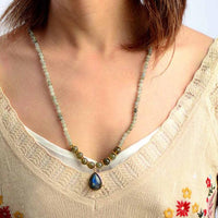 Labradorite Serenity Wrap Bracelet–Necklace styled as a single-strand necklace with teardrop pendant, glowing labradorite gemstones, and gold-toned bead details. ALLORA JADE