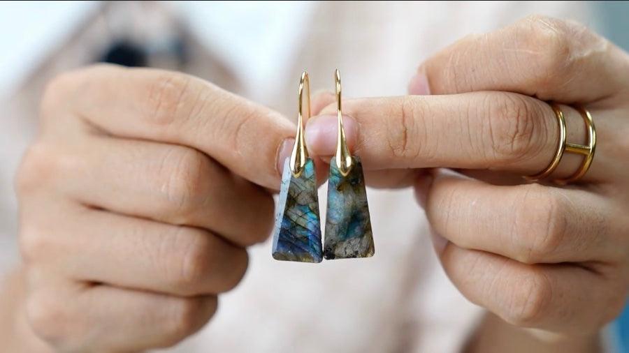Model holding pair of Labradorite Ascend Earrings. | ALLORA JADE