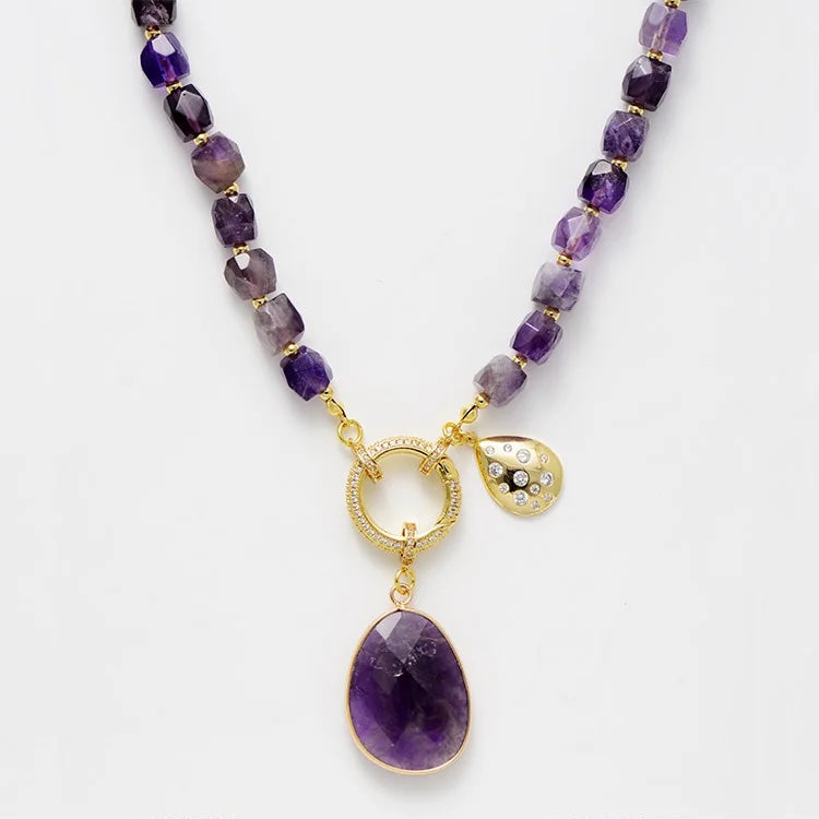 Purple beaded necklace with gold accents on a white background. Amethyst Pavé Statement Necklace | ALLORA JADE