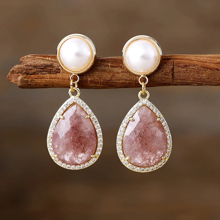 Strawberry Quartz Pavé Teardrop Dangle Earrings featuring rosy-pink gemstone drops framed by sparkling rhinestones, with imitation pearl studs in gold-coloured settings.