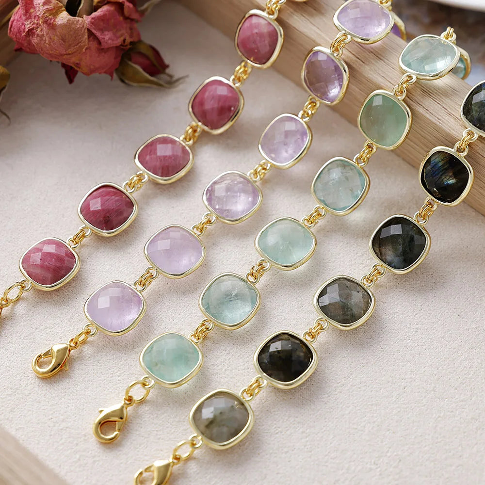 Bracelets with multicoloured gemstones on a textured surface