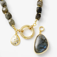 Necklace with gold and labradorite beads on a white background. Labradorite Pavé Statement Necklace | ALLORA JADE