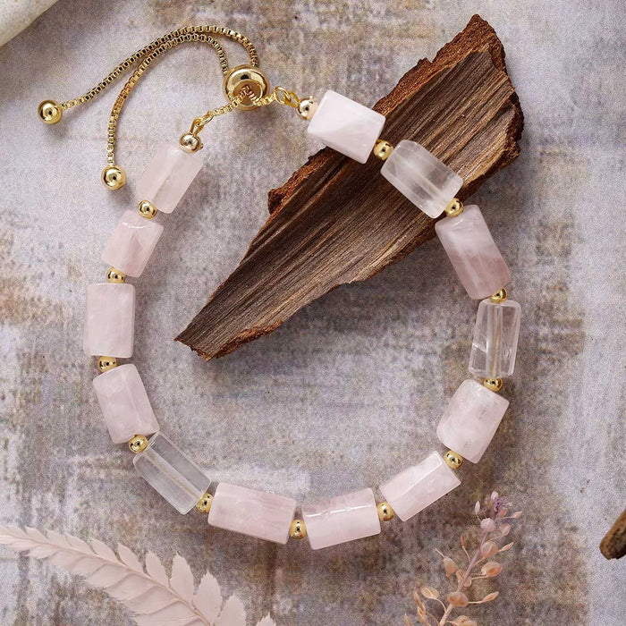 Bracelet with pink and clear beads on a textured surface