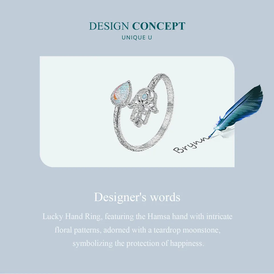 Jewelry design concept with a ring featuring a teardrop moonstone on a light blue background.