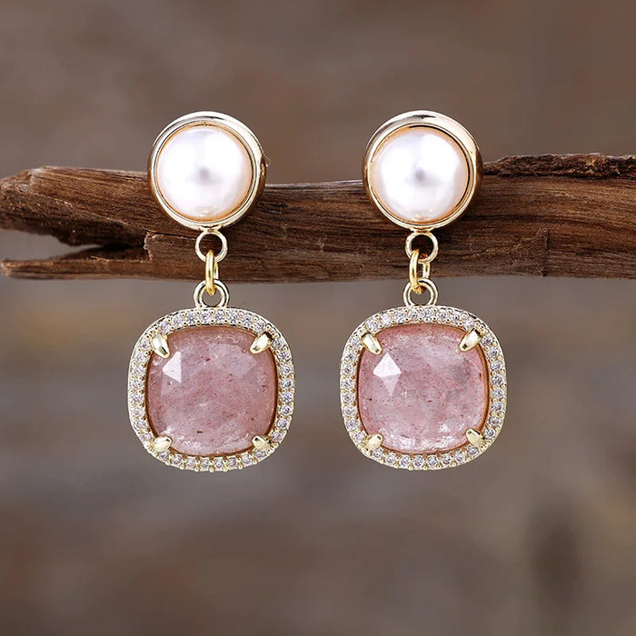 Strawberry Quartz Pavé Cushion Dangle Earrings featuring rosy-pink gemstone drops framed by sparkling rhinestones, with imitation pearl studs in gold-coloured settings.