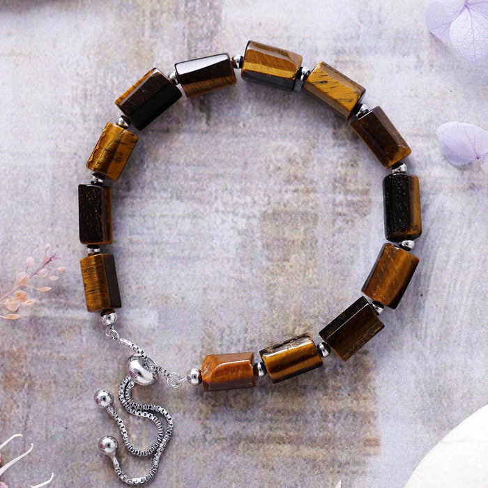 Bracelet with brown beaded design on a textured surface