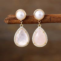 Rose Quartz Pavé Teardrop Dangle Earrings featuring soft blush-pink gemstone drops framed by sparkling rhinestones, with imitation pearl studs in gold-coloured settings.